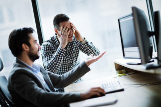 business colleagues working on computer and LAKHCQ9