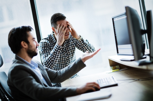 business colleagues working on computer and LAKHCQ9