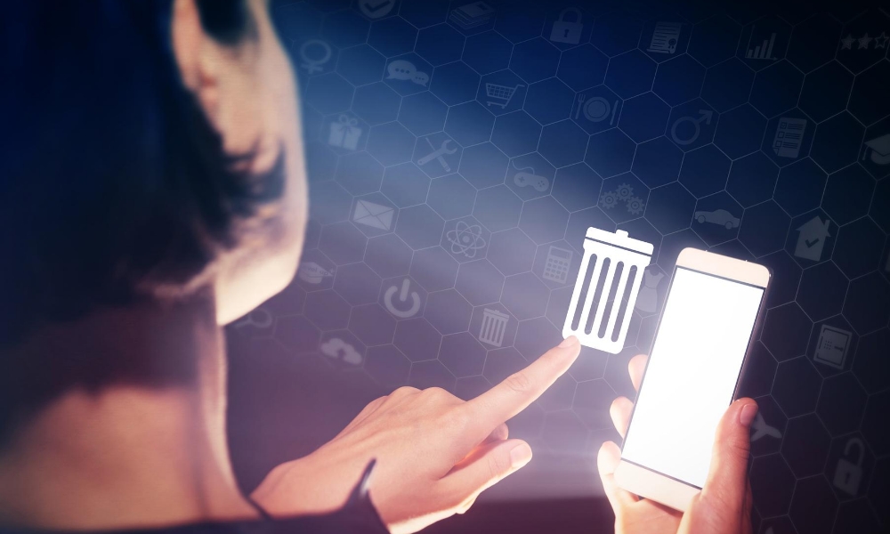 woman deleting software to protect business against malware